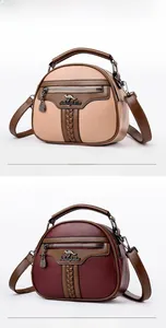 Detailed comparison of khaki and burgundy crossbody bags in high-quality pebble grain leather