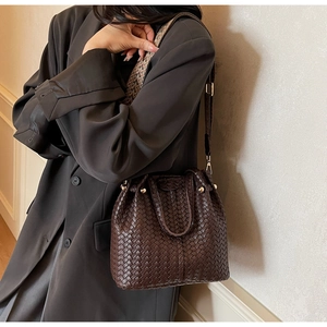 Vintage woven bucket bag in dark brown with ethnic style wide woven shoulder strap