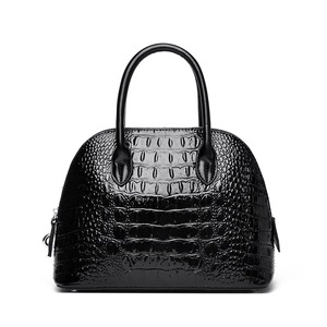 Classic black dome handbag with glossy crocodile pattern and silver zipper hardware