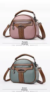 Detail of purple and green leather handbags with kangaroo logo and woven texture trim