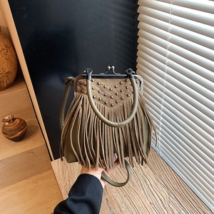 Vintage olive green suede handbag with fringe, metal rivets and kiss-lock closure