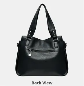 Vue arrière du sac cabas noir avec poche zippée pratique et détails en métal argenté