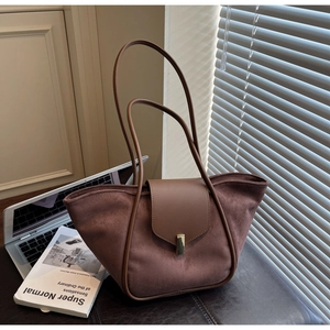 Close-up of coffee brown suede tote bag with elegant gold metal buckle and dual straps