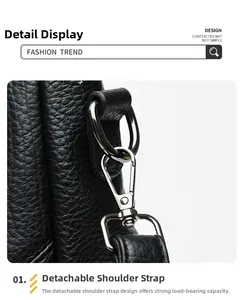 Détail du fermoir mousqueton argenté et de l'anneau D sur un sac en cuir noir