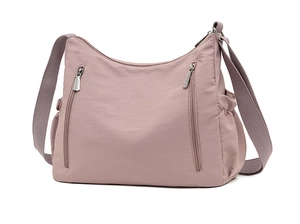 Detail of multi-pocket oxford cloth shoulder bag with vertical zippers and side pockets