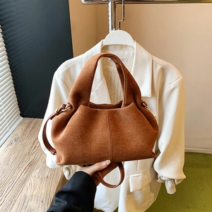 Brown faux suede cloud dumpling bag with elegant pleats and gold hardware accents