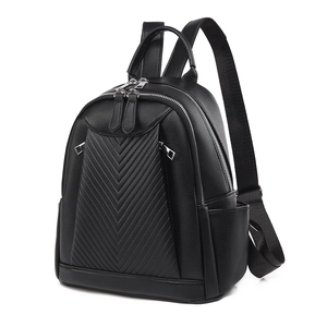 Black chevron quilted faux leather backpack with silver zippers and side pockets