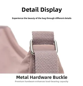 Detail of durable oxford bag strap with reinforced metal ring and silver buckle hardware