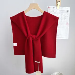 Detail of 100% wool knit shawl showing premium thick texture and washing label