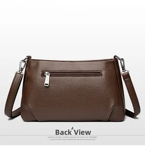 Detailed back view of brown lychee grain leather crossbody bag with hidden zipper pocket