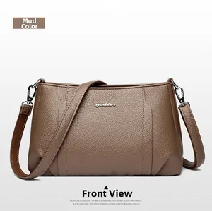 Front view of mud color leather crossbody bag with silver logo and adjustable strap