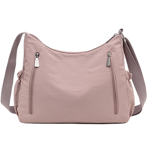 Oxford cloth crossbody bag in dusty pink with multiple pockets and adjustable strap