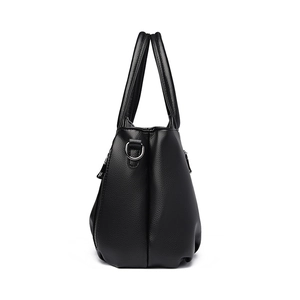 Sac à main classique en cuir noir à texture litchi avec doubles poignées et anneau en D