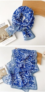 Detail of blue and white vintage floral print on lightweight silky chiffon scarf