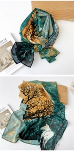 Detail of sheer silk scarf featuring retro forest animal print and artistic green texture