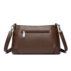 Minimalist dark brown lychee leather crossbody bag with silver hardware and back pocket