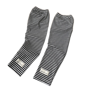 Classic black and white striped knit arm sleeves with minimalist brand label for women