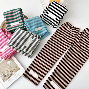 Long striped knit arm sleeves in colorful patterns for office and outdoor protection