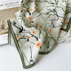 Elegant lightweight floral silk scarf with green borders and orange flower patterns