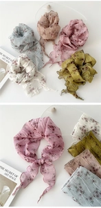 Detail of pleated floral chiffon neckerchief with ruffled edges in five soft colors