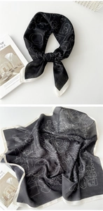 Detail of lightweight black and white floral cotton scarf with elegant edge stitching