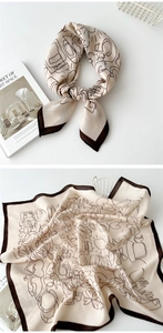 Close-up of beige linen silk square scarf with brown abstract line art and floral patterns