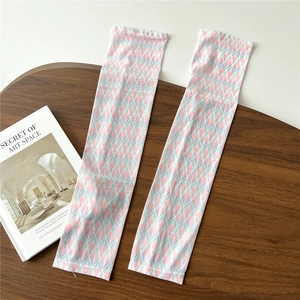 Detail of floral cooling sleeves in light purple and pink on a rustic wooden table
