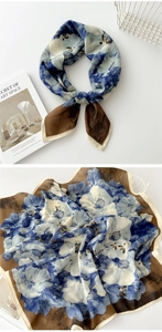 Detail of floral linen silk scarf showing Klein blue patterns and contrast hem