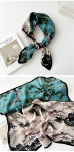 Detail showing elegant crane and landscape print on blue and white cotton linen scarf