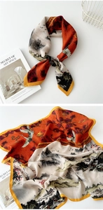 Detail view of cotton-linen silk scarf with traditional oriental landscape print and cranes