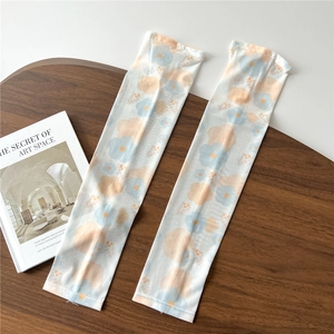 Detail shot of ice silk sun protection sleeves with fresh blue and orange floral patterns