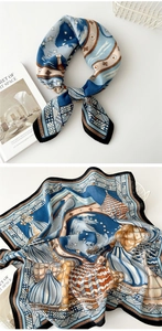Detailed view of square silk scarf featuring blue and orange artistic geometric prints