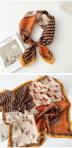 Detail of vintage cotton-linen scarf with horse print, houndstooth, and polka dot patterns