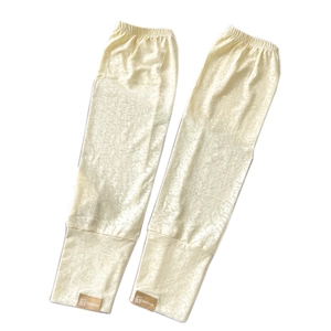 Manicotti in pizzo bianco crema con delicato motivo jacquard e polsini elasticizzati