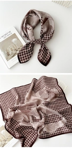 Detailed view of coffee and beige square scarf featuring houndstooth and floral patterns
