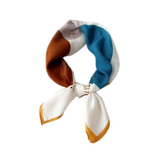 Chic geometric silk scarf with blue and caramel patterns and delicate yellow stitching