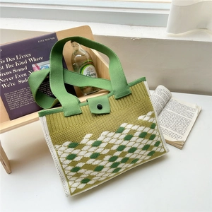 Green and white checkered knit tote bag with shoulder straps and button closure