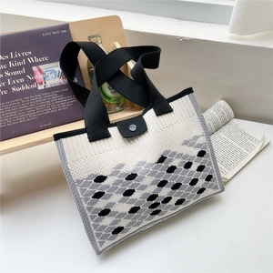 Woven knit tote bag with black and white geometric pattern for stylish daily commuting