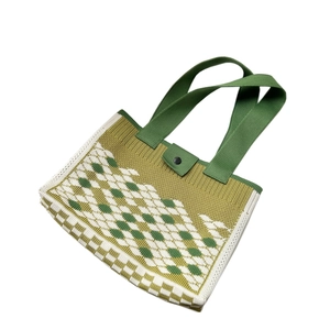 Woven knit tote bag featuring a green and yellow geometric checkerboard pattern