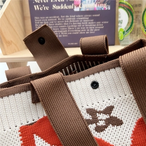 Knitted floral tote bag with brown geometric pattern and magnetic snap closure