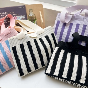 Striped knit tote bag collection featuring stylish vertical patterns in vibrant colors