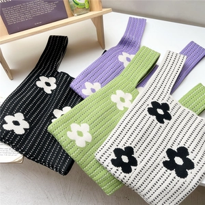 Handmade floral knit tote bag in black purple green and white for women lifestyle look