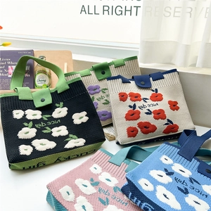 Floral knitted tote bag with Nice Day slogan shown in five vibrant color styles