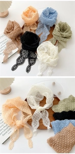 Close-up of floral lace skinny scarves in multiple colors for hair or neck styling