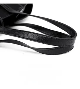 Detail of durable black litchi texture leather shoulder strap with fine edge finishing