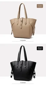 Close-up of khaki and black leather tote bags with pebble grain texture and metal buckle