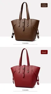 Close-up of litchi grain texture and metal hardware on brown and red tote bags