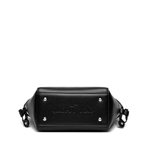Bottom view of black litchi grain tote bag showing four protective silver metal studs