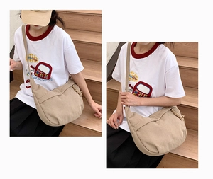 Macro view of khaki corduroy texture on minimalist crescent-shaped crossbody bag