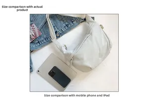 Corduroy half-moon bag size comparison with tablet and phone showing medium capacity